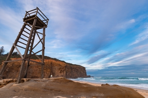 Old wooden lifeguard, shark lookout tower on Redhead Beach - Australian Stock Image