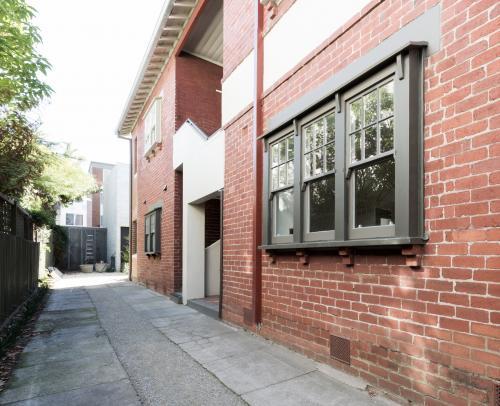 Older style red brick apartment building exterior - Australian Stock Image