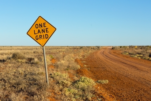 One Lane Grid sign on outback road - Australian Stock Image