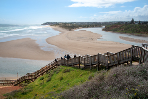 Onkaparinga River Mouth near Adelaide with a st of wooden stairs leading to the beach - Australian Stock Image