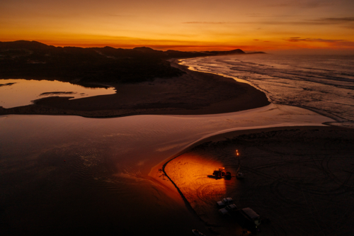 Orange sunrise and water reflections over Irwin Inlet - Australian Stock Image