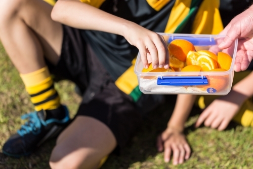 Oranges at half time of kids football game - Australian Stock Image