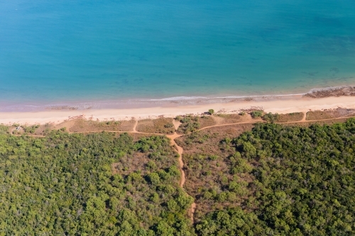Outback dirt track leads to remote Northern Territory beach - Australian Stock Image