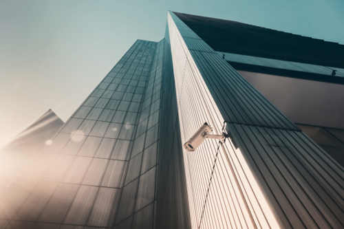 Outdoor street CCTV Security camera installed on the building wall in the city - Australian Stock Image
