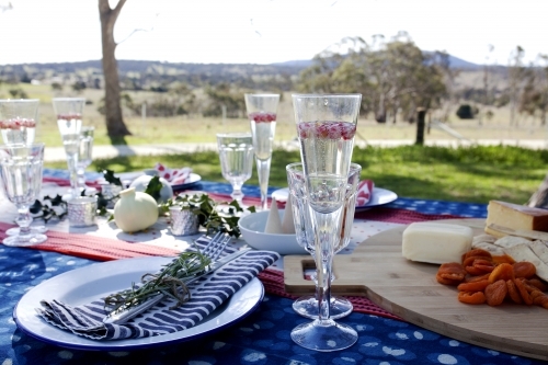 Outdoor table setting ready for Christmas celebration - Australian Stock Image