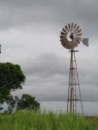 Overcast Farm View of windmill - Australian Stock Image