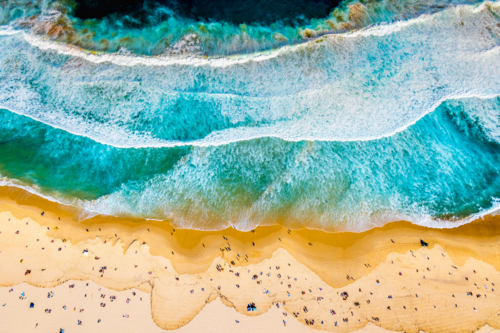 overhead abstract view of the surf and sand at Bondi Beach - Australian Stock Image