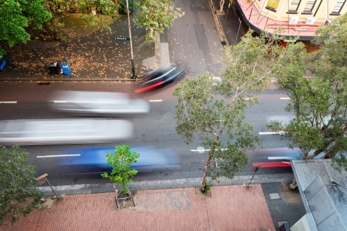 overhead of moving traffic on city street - Australian Stock Image