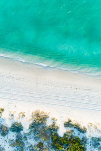 Overhead of tropical turquoise white sandy beach - Australian Stock Image