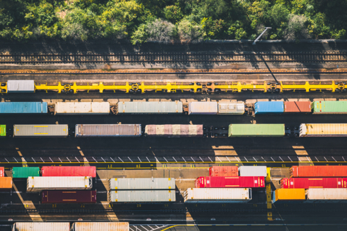 Overhead shot of a colourful carriages in a freight train yard - Australian Stock Image