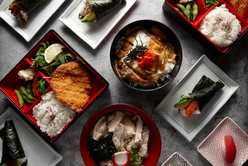 Overhead shot of different food dishes on a flat surface. - Australian Stock Image