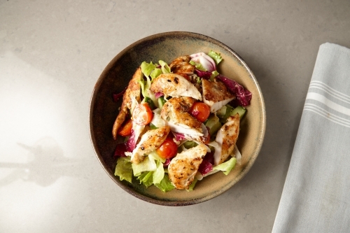Overhead shot of gourmet chicken caesar salad - Australian Stock Image