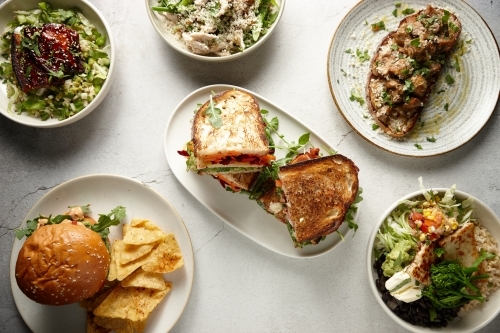 Overhead shot of various lunch dishes - Australian Stock Image