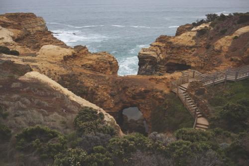 Overlooking cliffs and stairs of the Great Ocean Road landscape - Australian Stock Image