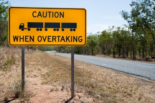 Overtaking signage on an empty road