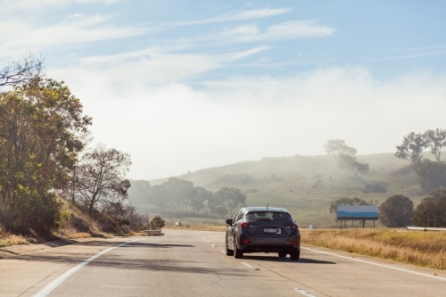 P plate on car in right hand lane overtaking - Australian Stock Image
