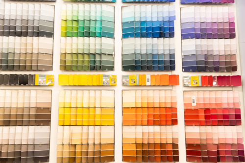 paint samples on a display wall in a hardware store - Australian Stock Image