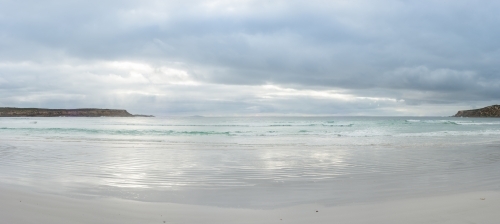 Panorama of bay sheltered by headlands