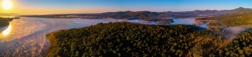 Panorama of sunset over Lake Samsonvale and bushland - Australian Stock Image