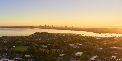 Panoramic sunrise over Applecross and the Swan River with Perth skyline on the horizon - Australian Stock Image