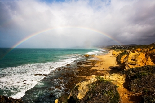 Panoramic view of coastline with rainbow - Australian Stock Image