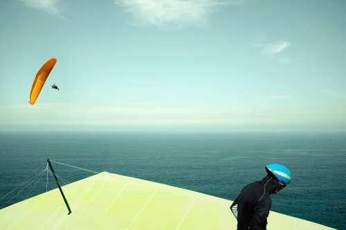 Paraglider and hang glider on a clear day - Australian Stock Image