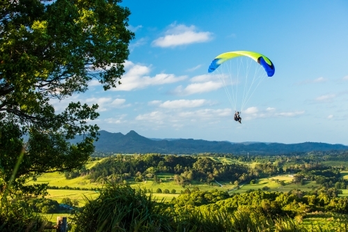 Paragliding above the hinterland near Byron Bay in the Northern Rivers. - Australian Stock Image