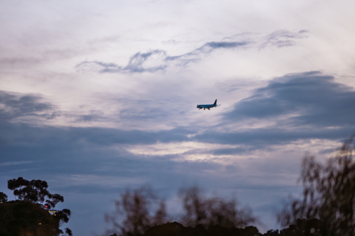 Passenger plane preparing to land at Adelaide Airport in the evening - Australian Stock Image