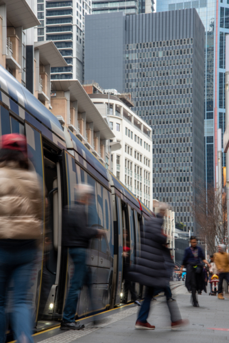 Passengers alighting tram in the city - Australian Stock Image