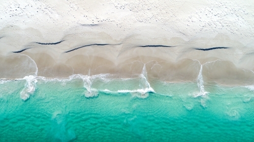 Patterns emerging as water returns to the ocean - Australian Stock Image