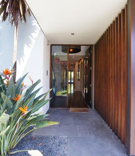 Paved and glass entrance to a contemporary home - Australian Stock Image