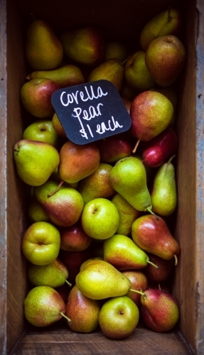 pears in a crate found in market - Australian Stock Image