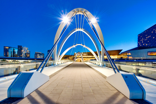 Pedestrian bridge leading to Melbourne Convention and Exhibition Centre at twilight. - Australian Stock Image