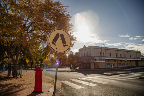 Pedestrian crossing in golden afternoon light at Wellington New South Wales - Australian Stock Image