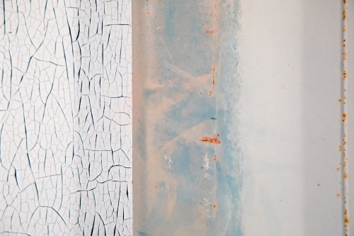 Peeling paint and rust textures on the side of an old shipping container - Australian Stock Image