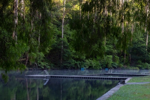 Pemberton Pool with still water reflecting trees - Australian Stock Image