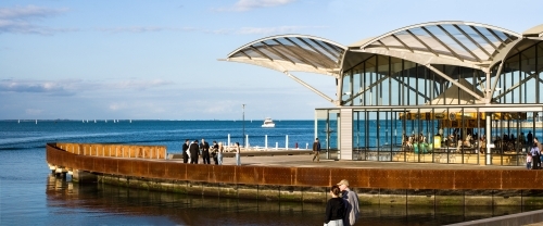 People and carousel on a city waterfront - Australian Stock Image