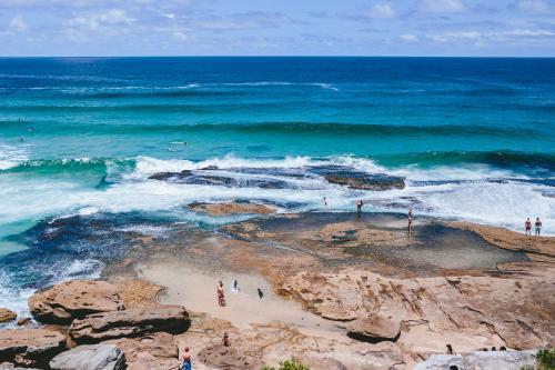 People in the rockpools between Tamarama and Bondi - Australian Stock Image