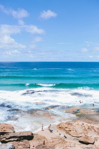 People in the rockpools between Tamarama and Bondi - Australian Stock Image