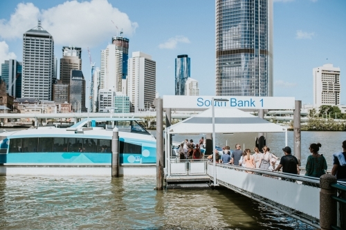 People lined up to board the City Cat boat at South Bank - Australian Stock Image