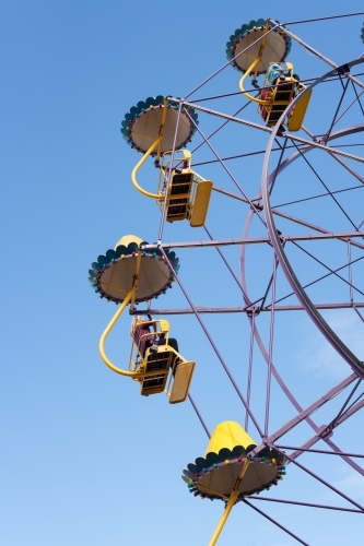 People on a ferris wheel at a city fun park - Australian Stock Image