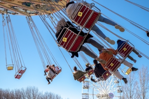 People riding a swing chair ride