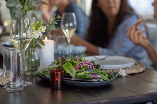 People Sharing Healthy Meal at Rustic Table Setting