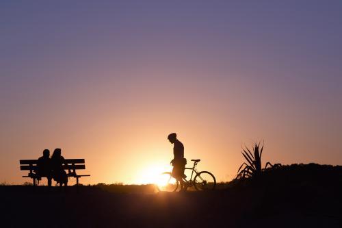 People silhoettes at sunset - Australian Stock Image