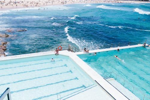People swimming at Icebergs in Bondi - Australian Stock Image