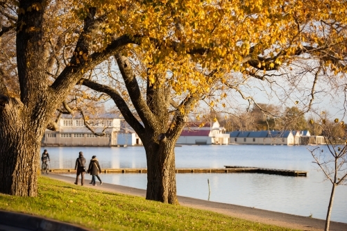 People walking near a lake - Australian Stock Image