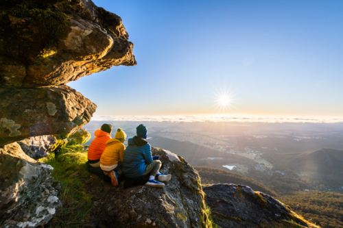 People watching the sunrise view from Boroka Lookout cliff at Grampians, Victoria, Australia - Australian Stock Image