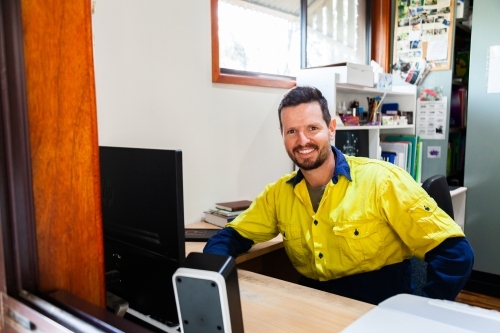 Person working on computer in home office - Australian Stock Image