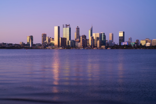 Perth City skyline at dusk across the Swan River - Australian Stock Image