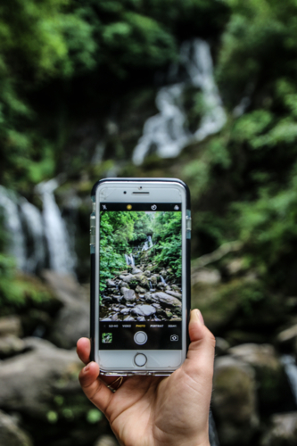 Photo of a waterfall on phone - Australian Stock Image